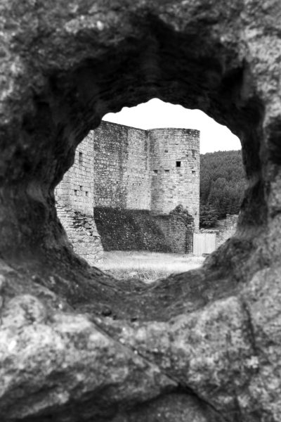 Old tower seen through a hole bricks